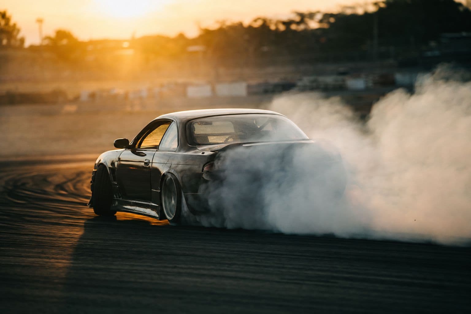 Formula Drift car mid-slide in tire smoke